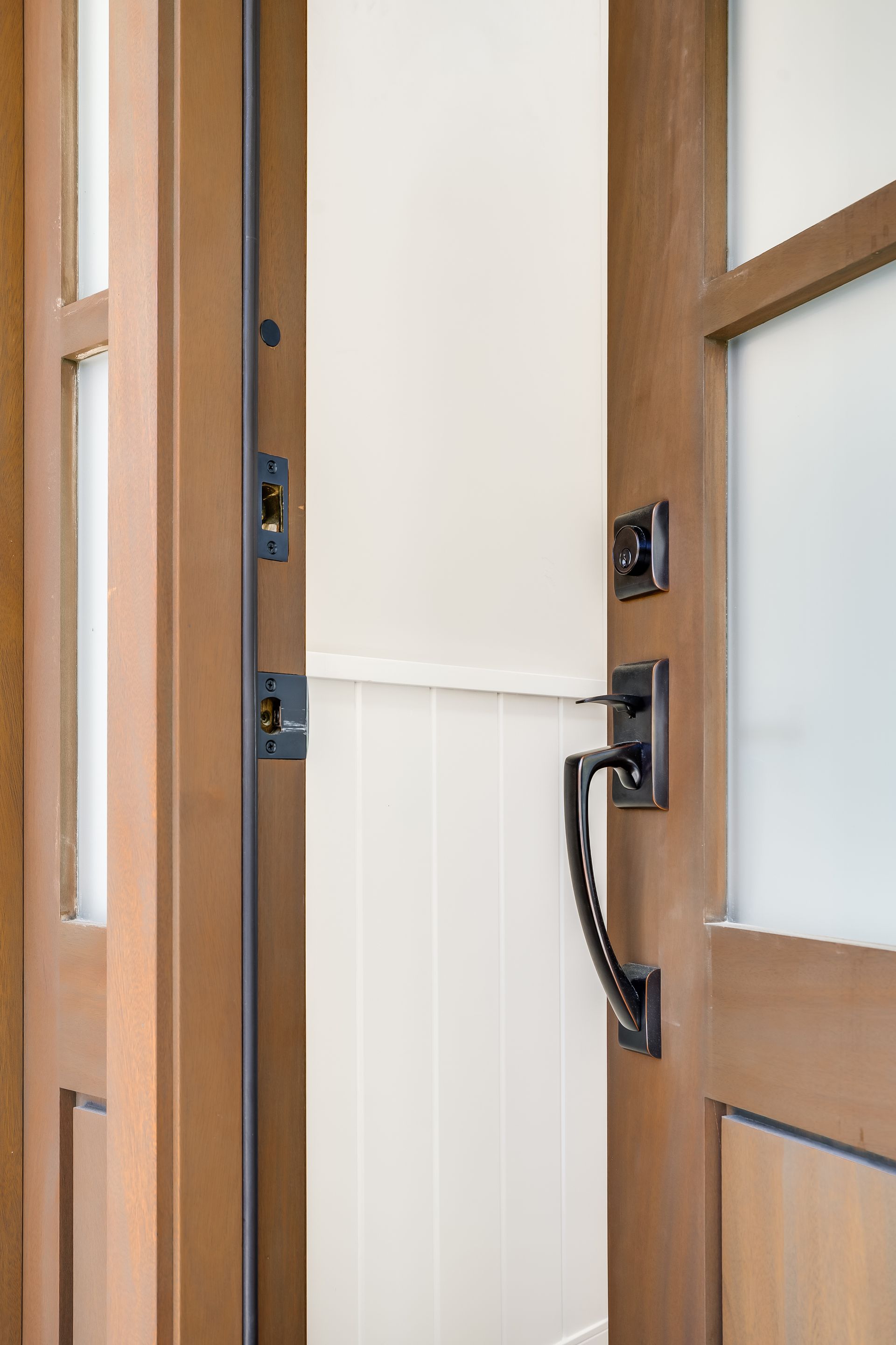 A close up of a wooden door with a handle.