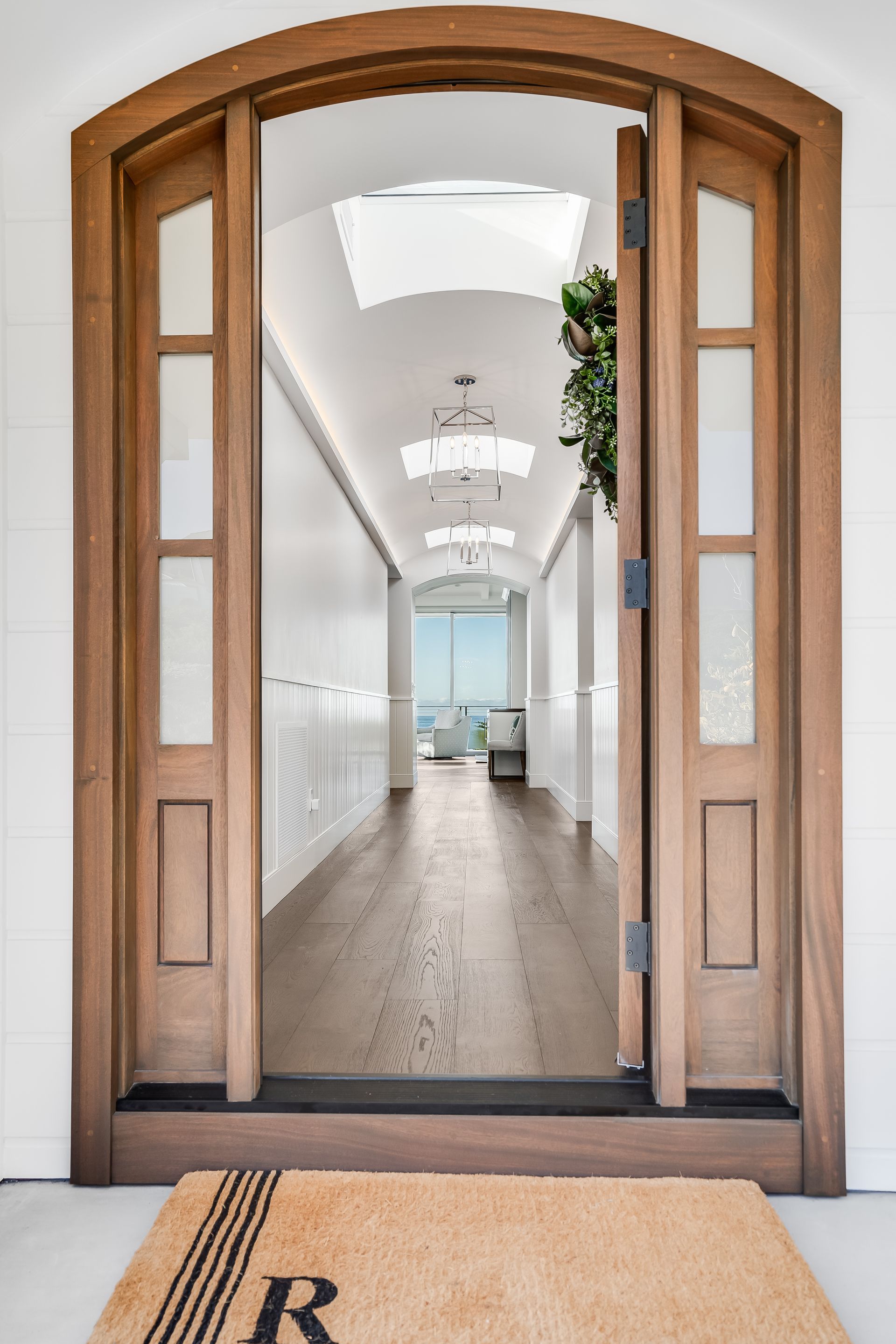A doorway with a welcome mat in front of it