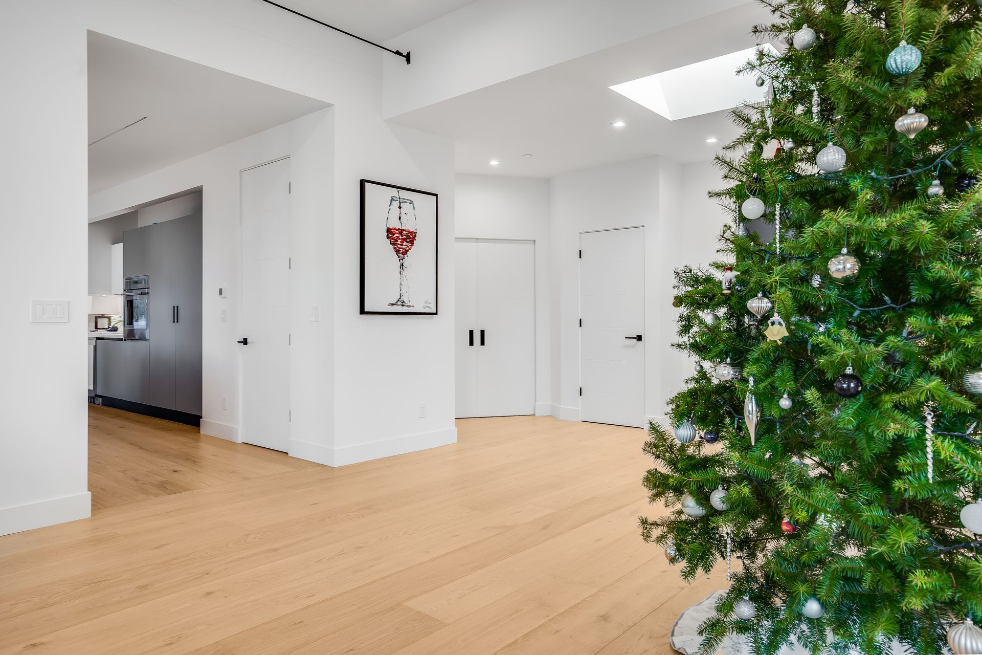There is a christmas tree in the middle of the room.