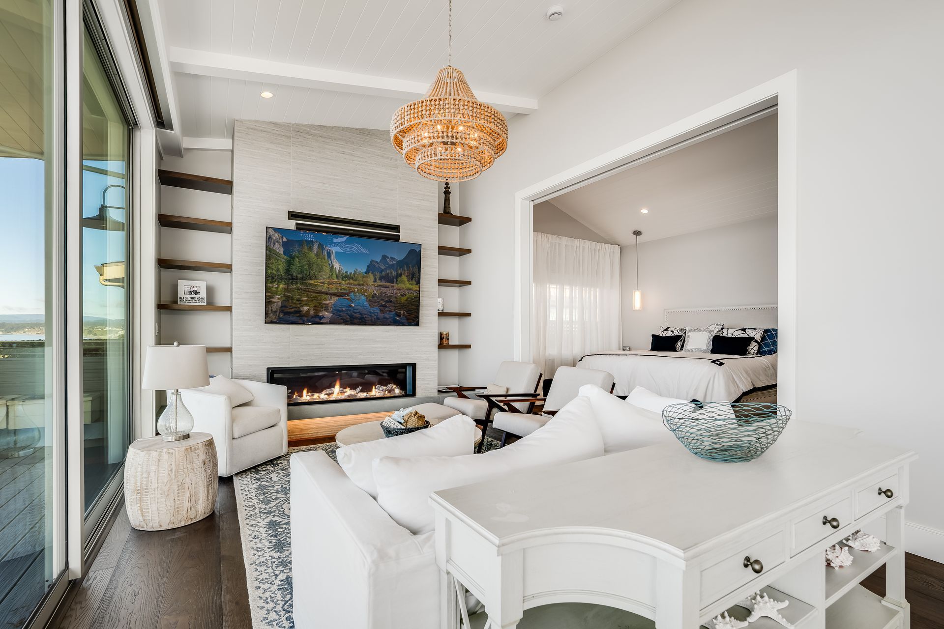 A living room with a fireplace and a flat screen tv.