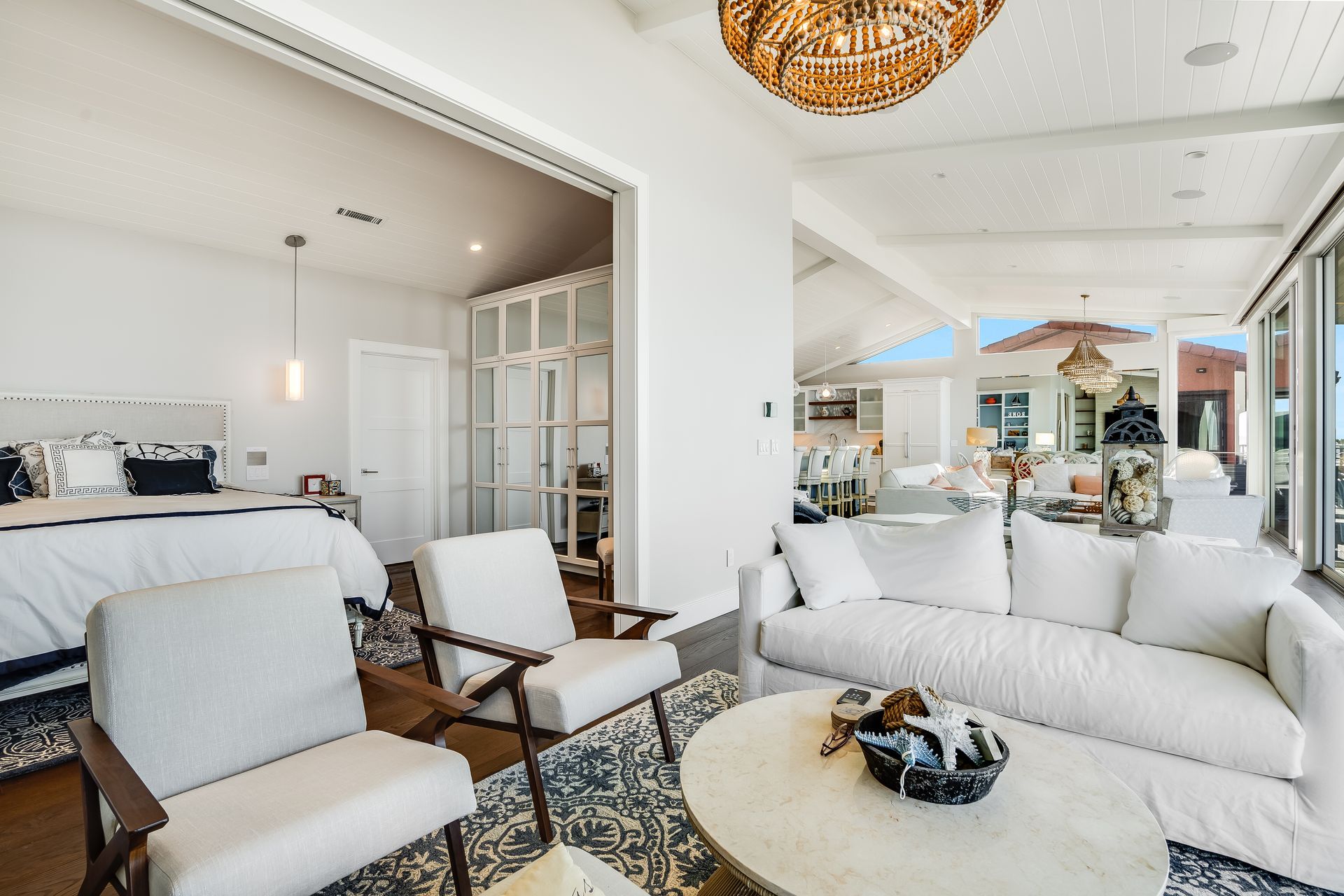 A living room with a couch , chairs and a coffee table