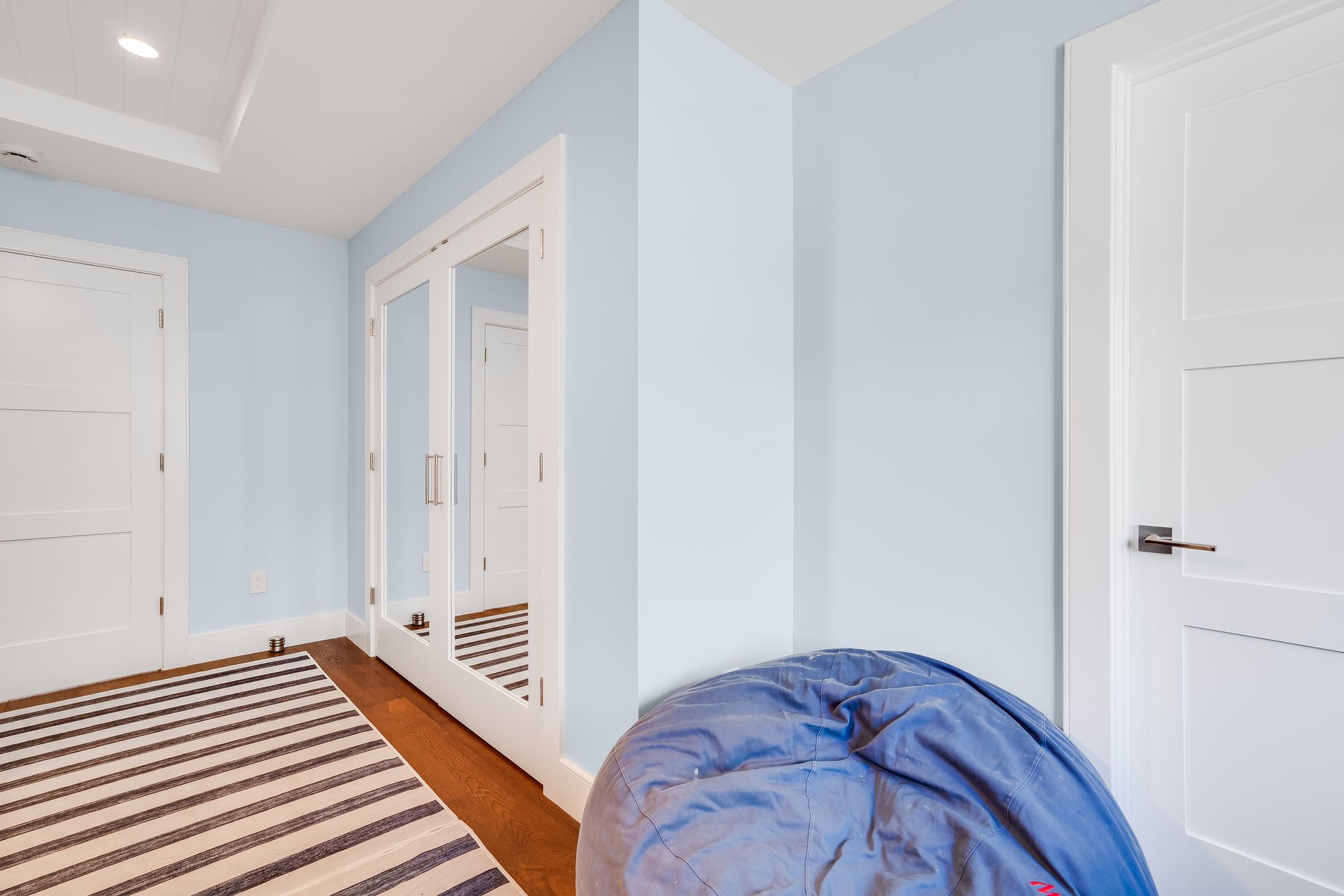 There is a bean bag chair in the middle of the room.