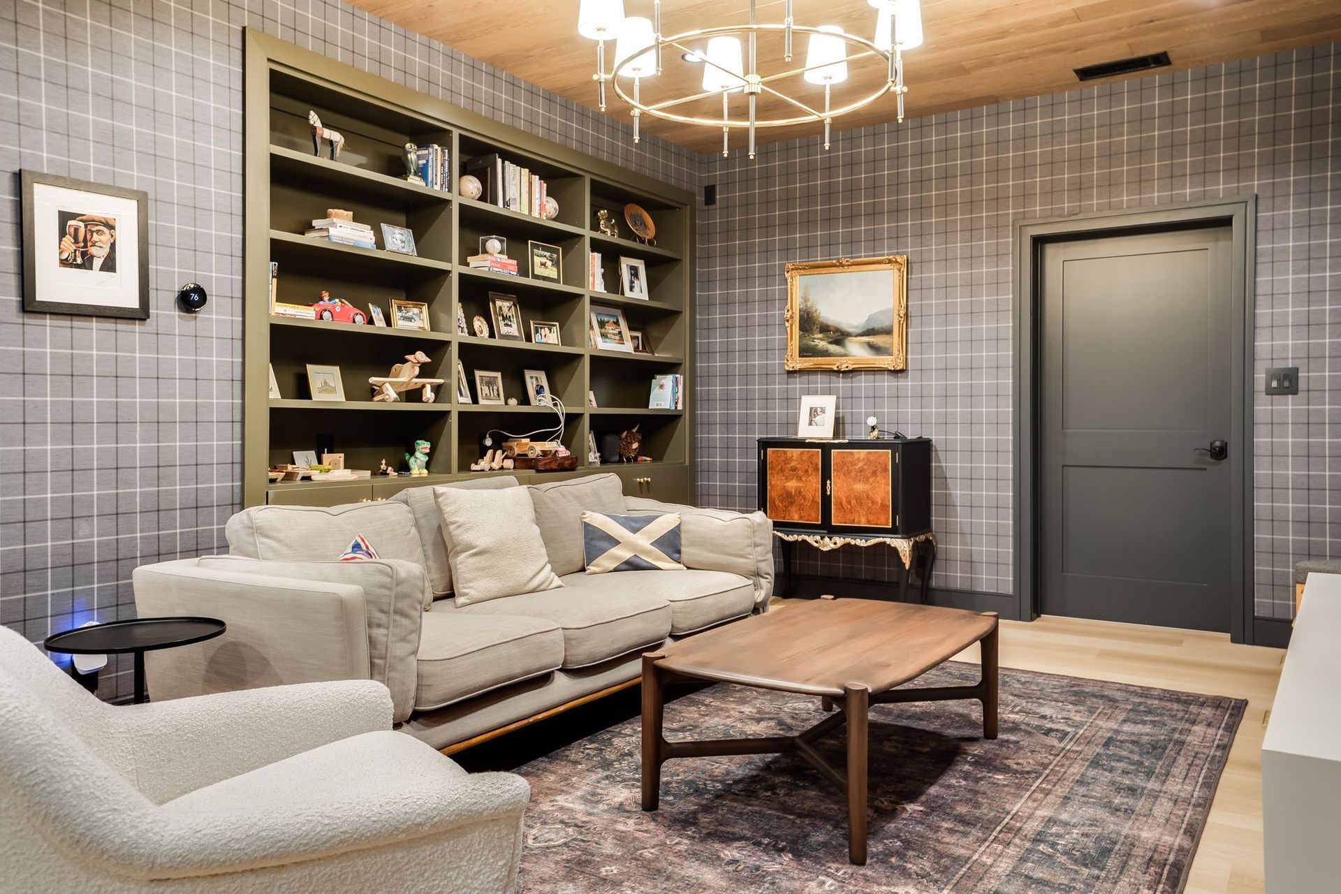 Hidden basement lounge with built-in shelving