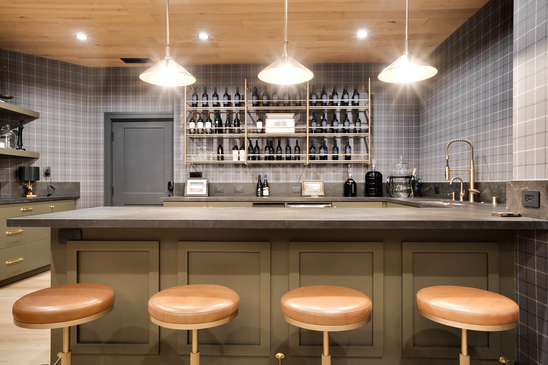 Custom cabinetry and satin brass details in the Douglass Lane speakeasy