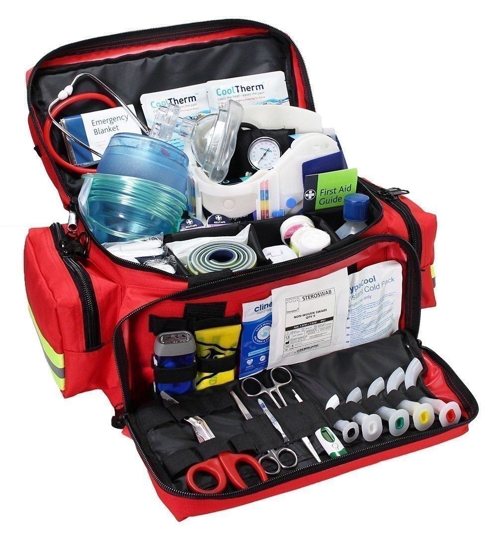 Open red first-aid kit with medical supplies and tools neatly organized inside.