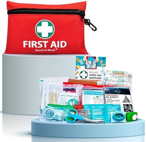 Red first aid kit with medical supplies and scissors on a light blue stand