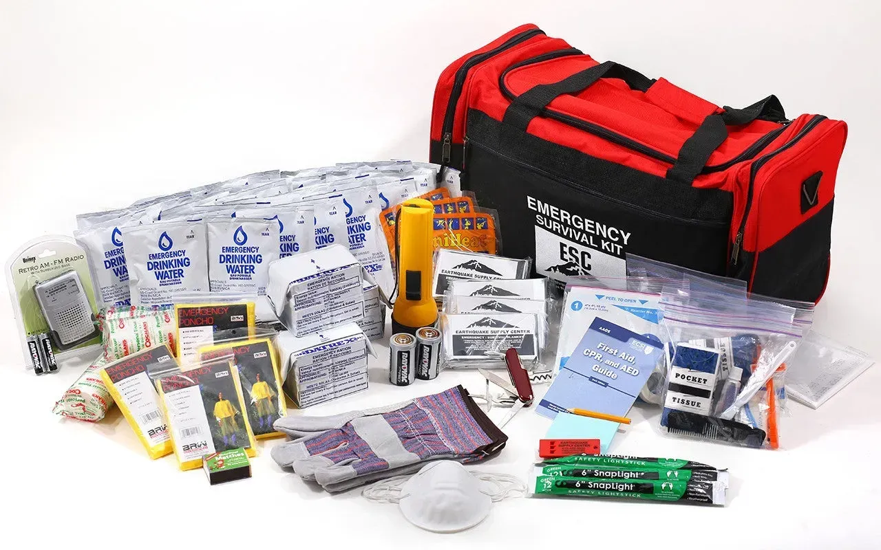 Emergency medical kit with red bag, first aid supplies, bandages, and medication scattered on a white surface