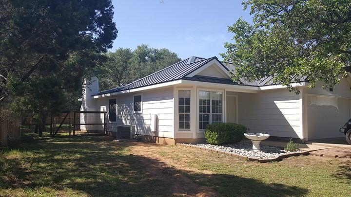 Grey Standing Seam Metal Roof by Austin Roofing and Construction 512-629-4949