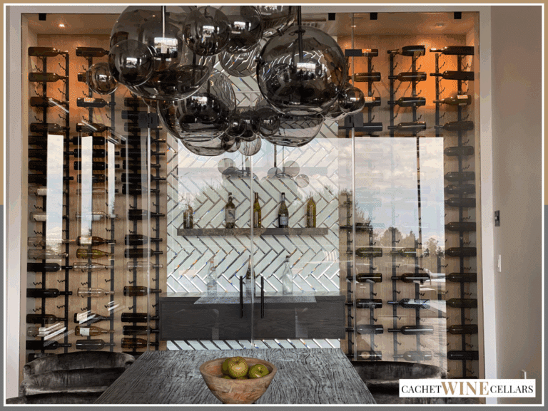 Frameless glass wine cellar doors seen from the house side in Dana Point