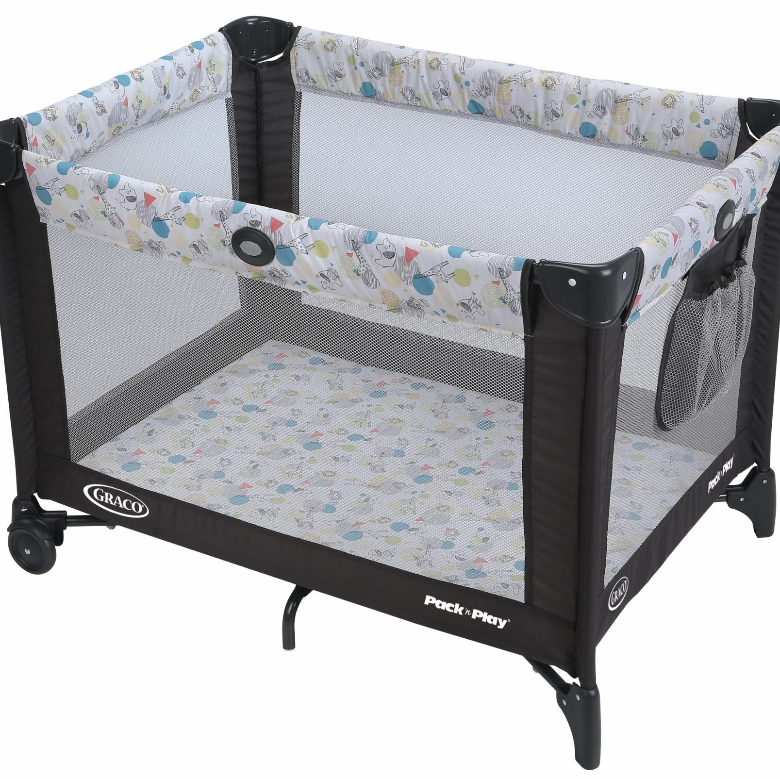 a black and white crib with a floral pattern on it