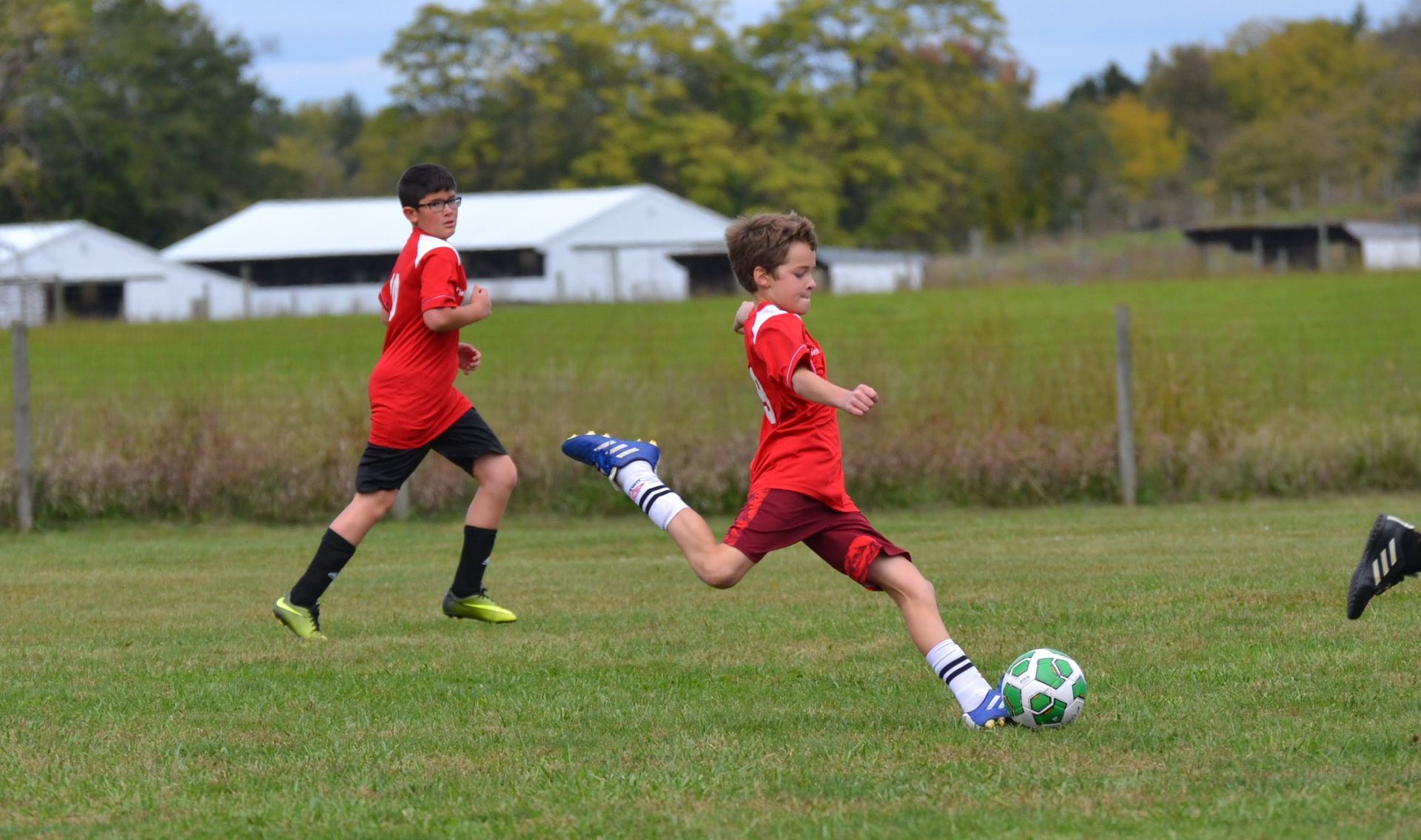 CCSL player taking a right footed shot on goal.