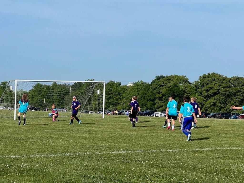 Clarke County Soccer League players going to goal.