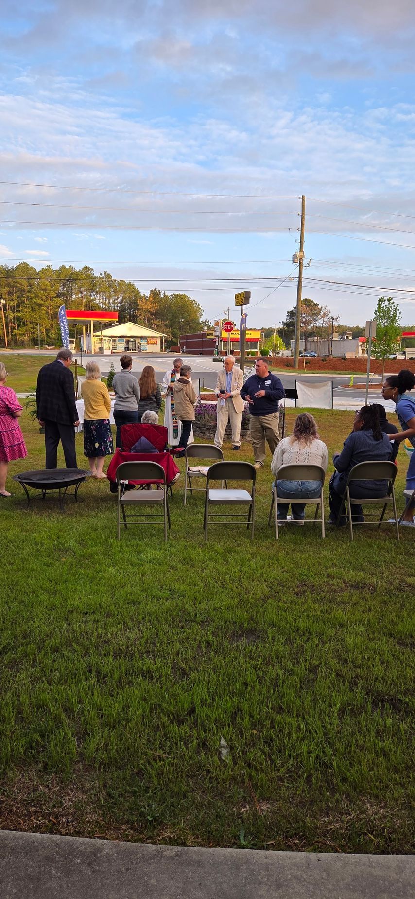 People seated on folding chairs for sunrise worship.