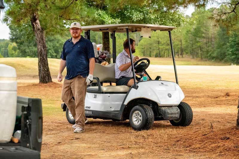 Two men on a golf course.