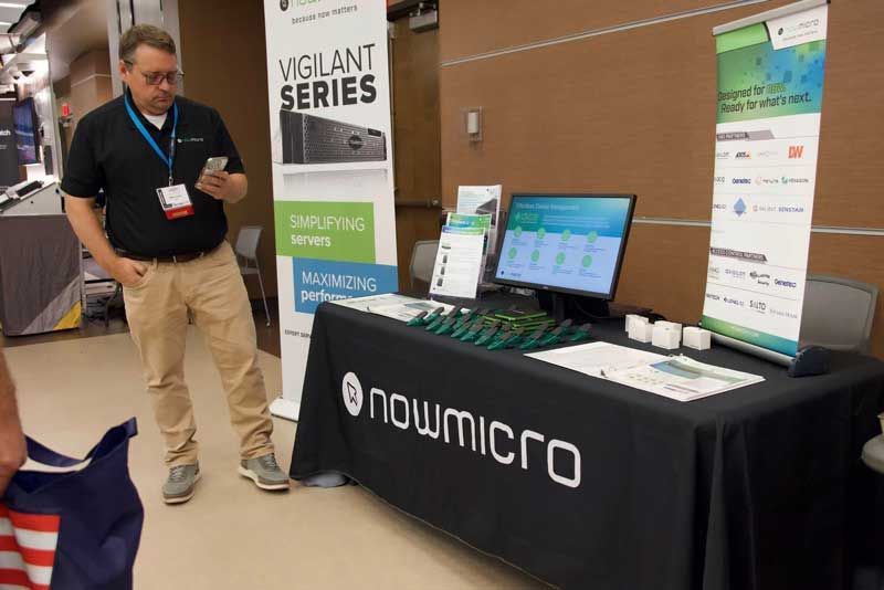 Man at a trade show booth.