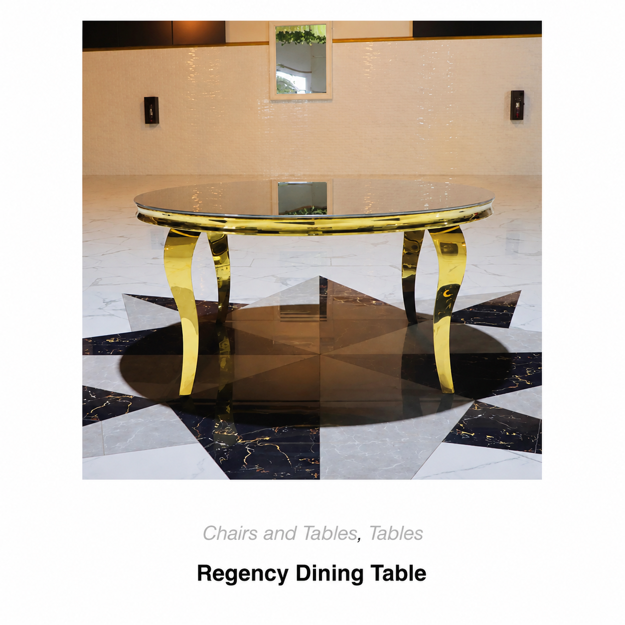 Gold Regency dining table with glass top in a modern room