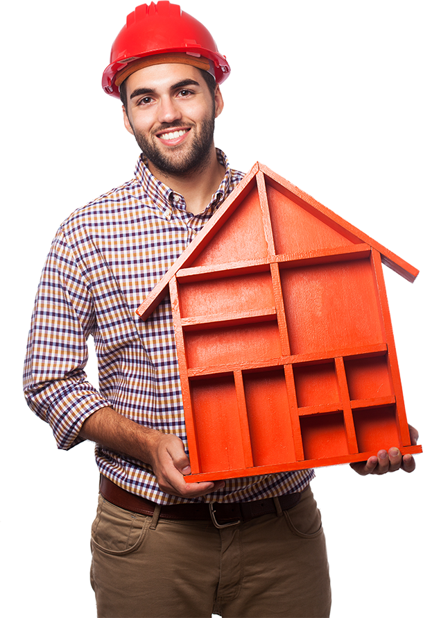 Man in hard hat holds red house-shaped shelf, smiling.