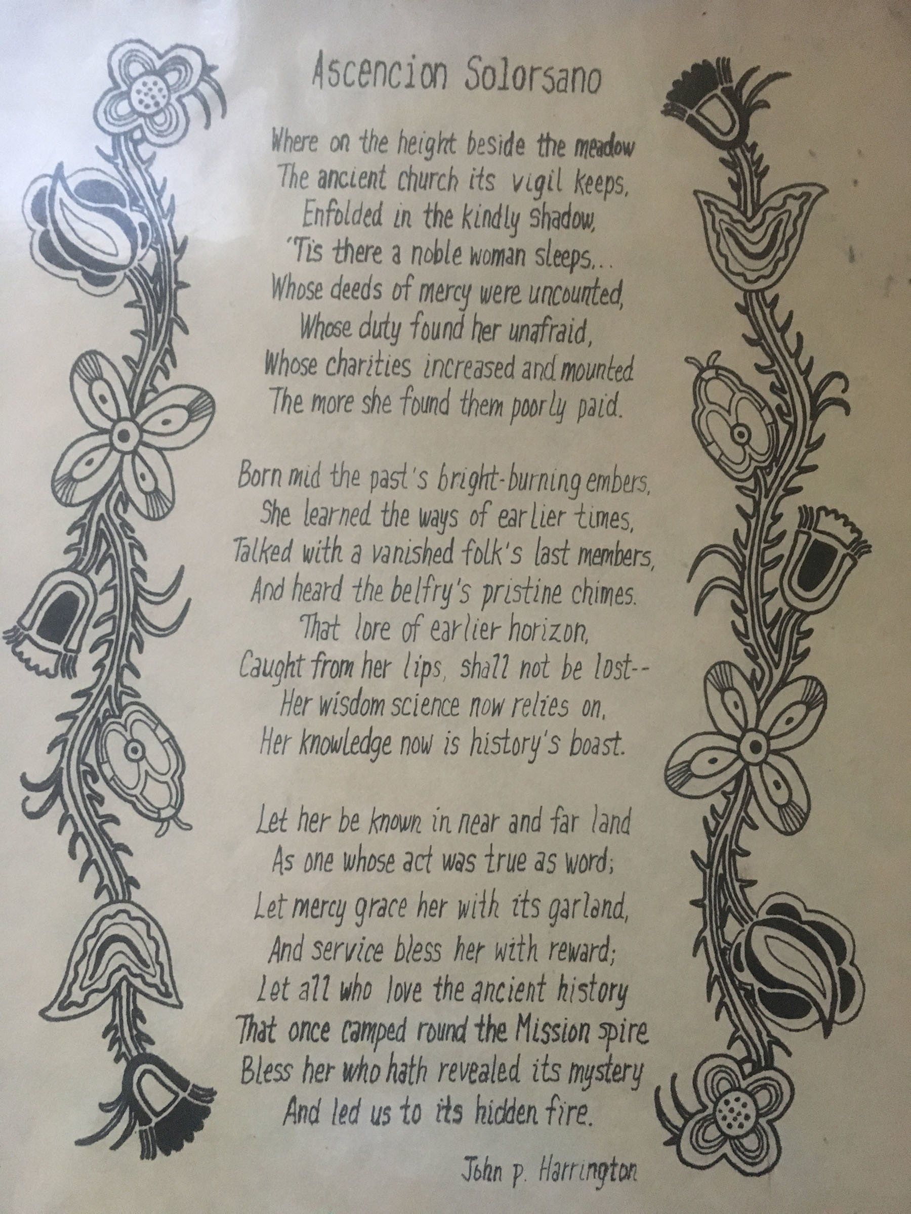 A black and white drawing of a poem with flowers on it