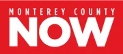 A red and white logo for monterey county now