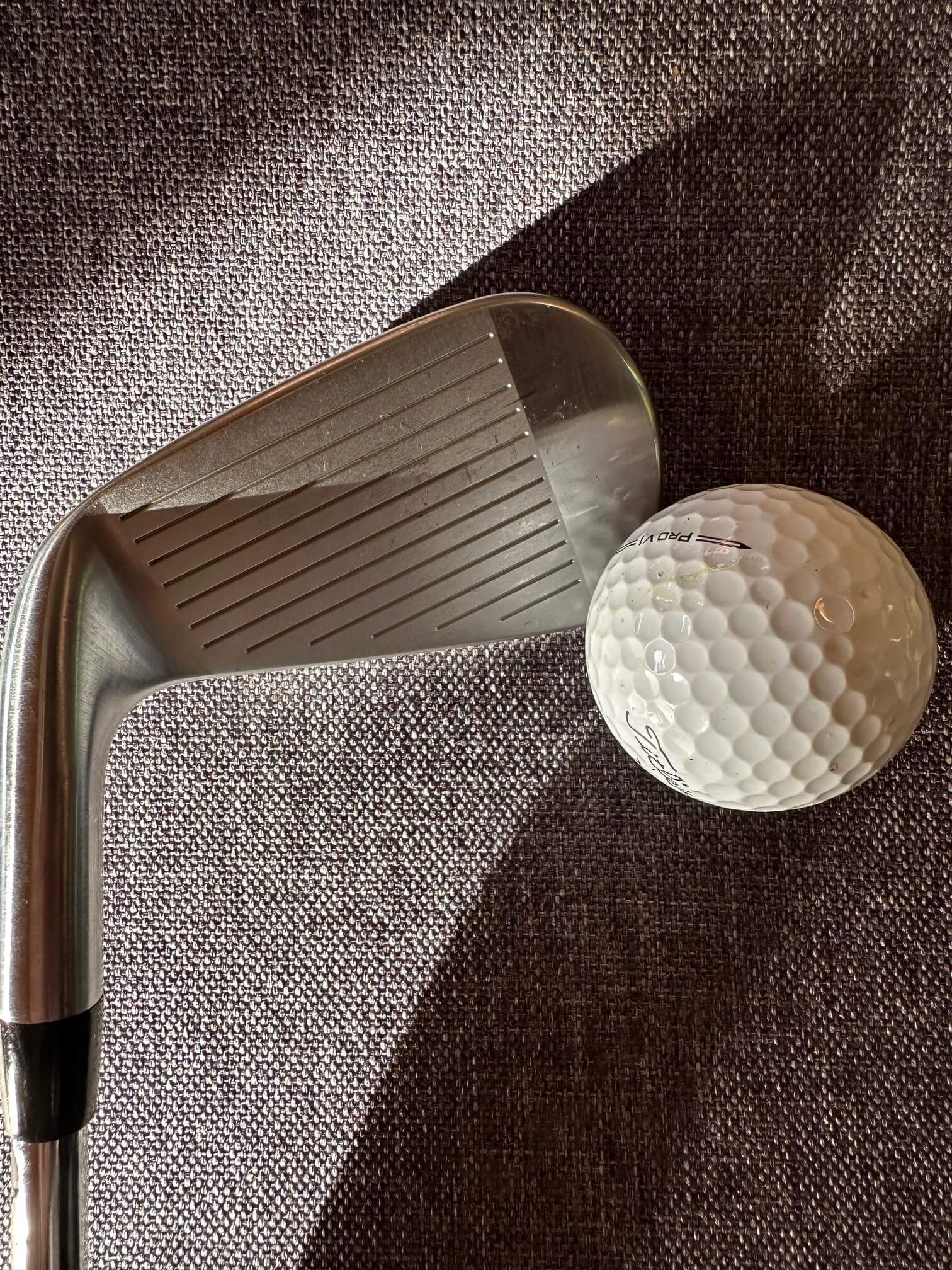 Titleist T100 iron and golf ball