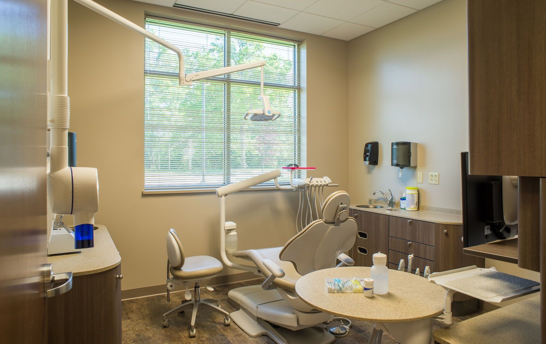 Dentist Office With Chair, Dental Tools, & Bright Window. PCE Construction Builds Medical Offices.