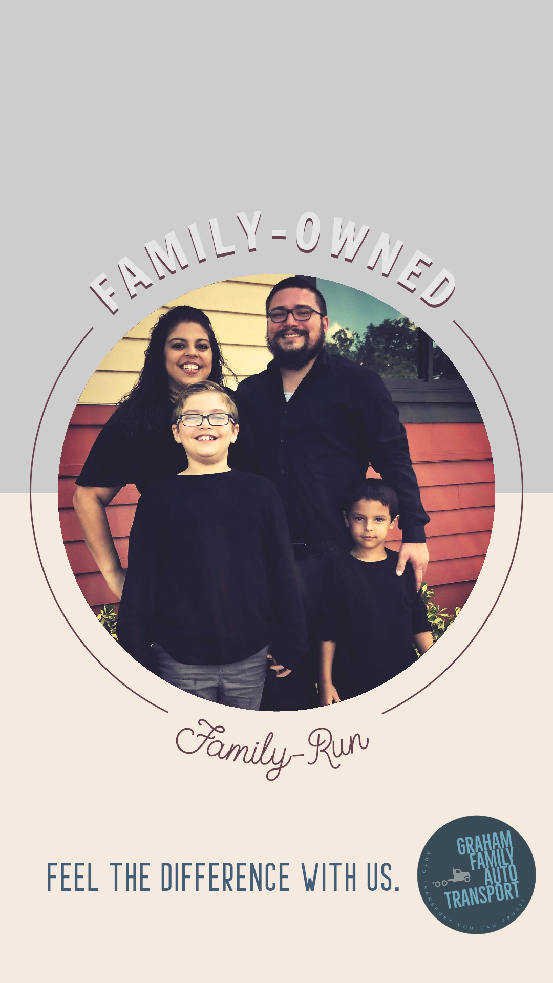 Family portrait. Smiling family of four in front of a red building. 