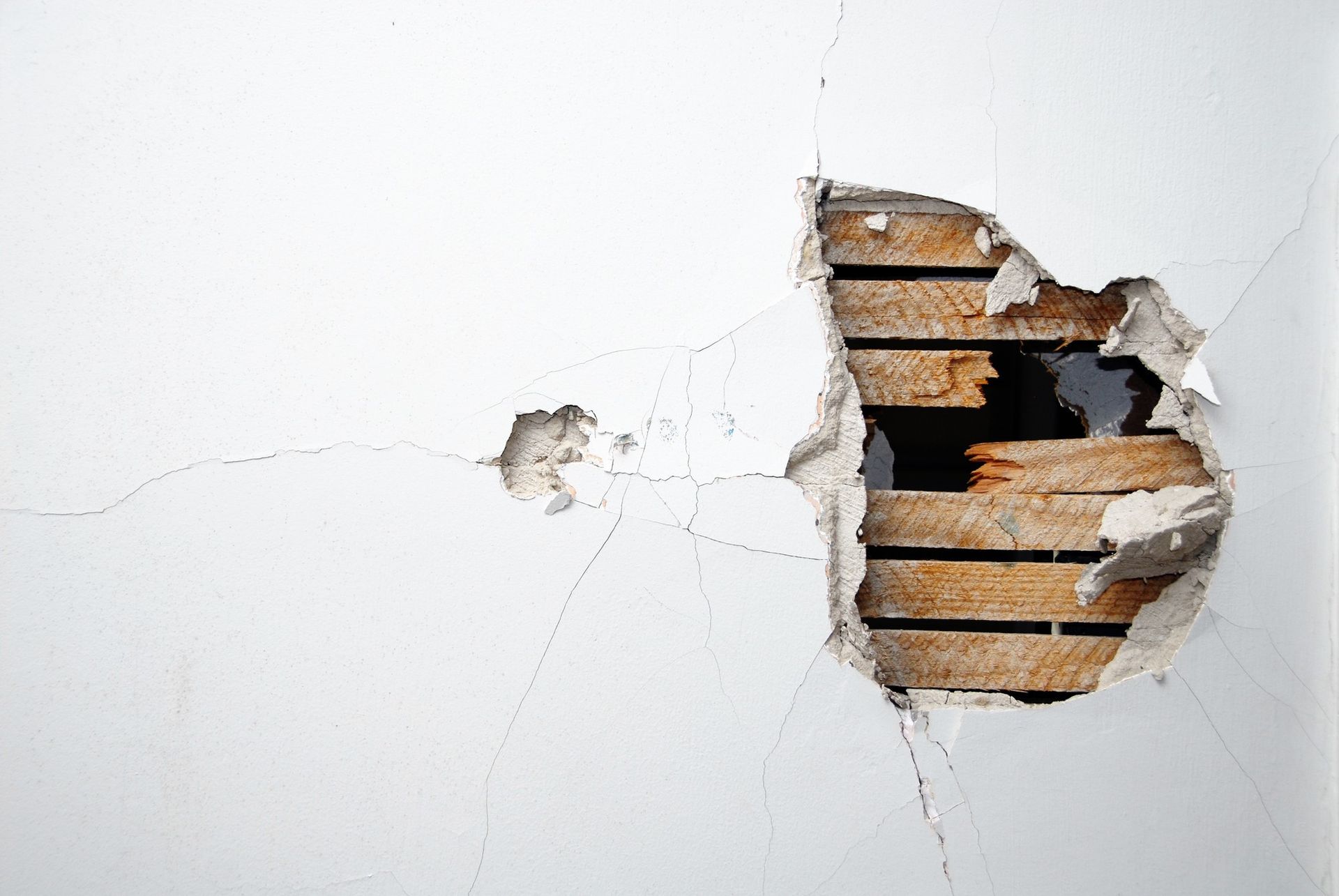 Hole in the plaster on a wall