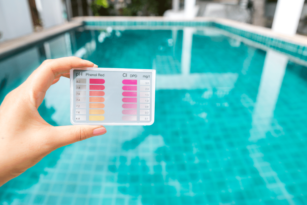 Man holding test kit for swimming pool
