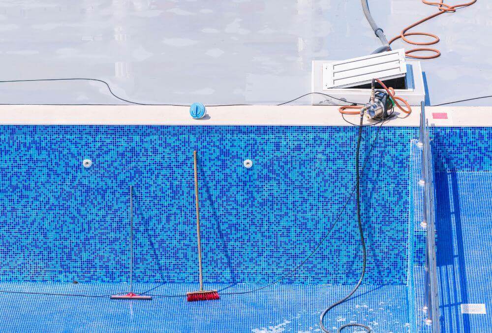 Empty tiled pool and pool system under repair