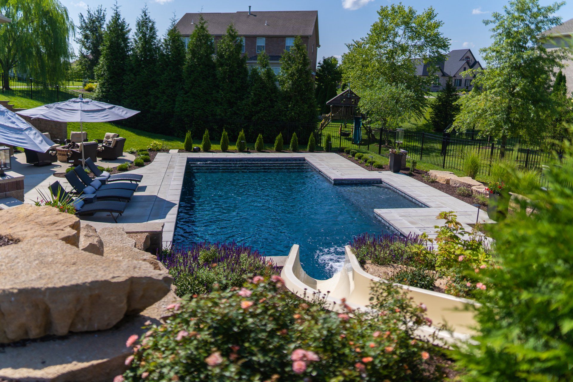 Square pool with slide feature