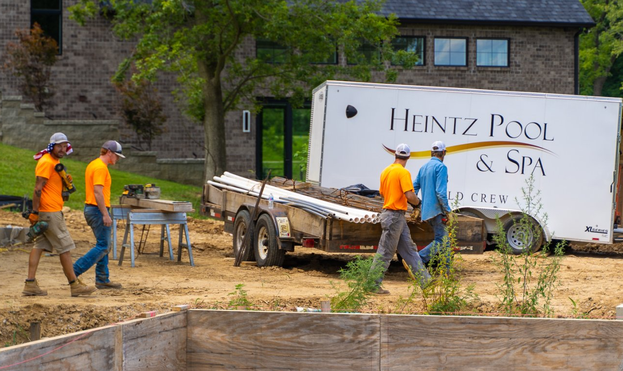 Heintz Pool & Spa team on site walking