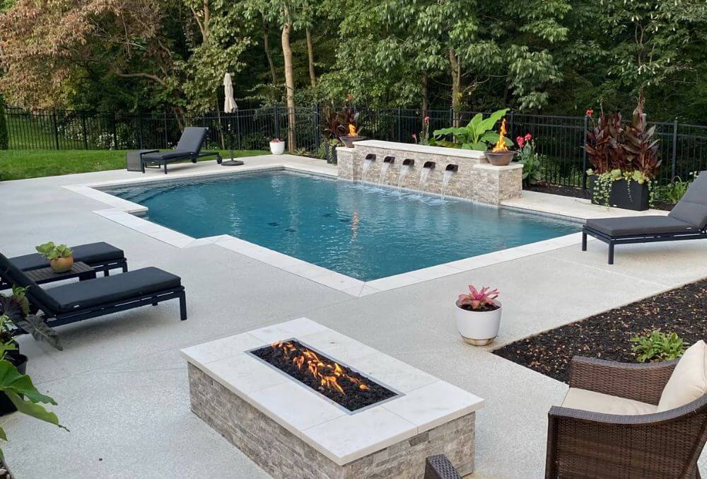 Luxury residential pool with firepit and pool water features