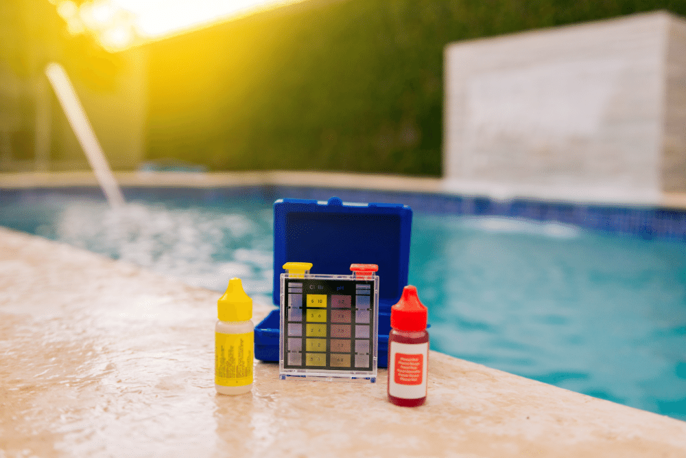 Chemical testing kit beside swimming pool