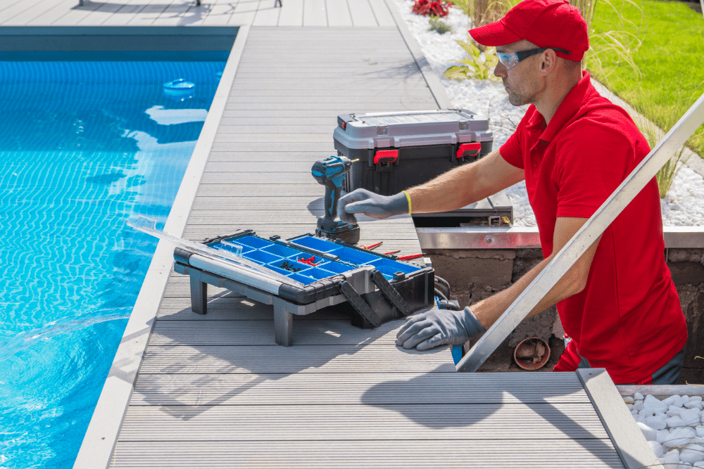 Man performing maintenance task on swimming pool