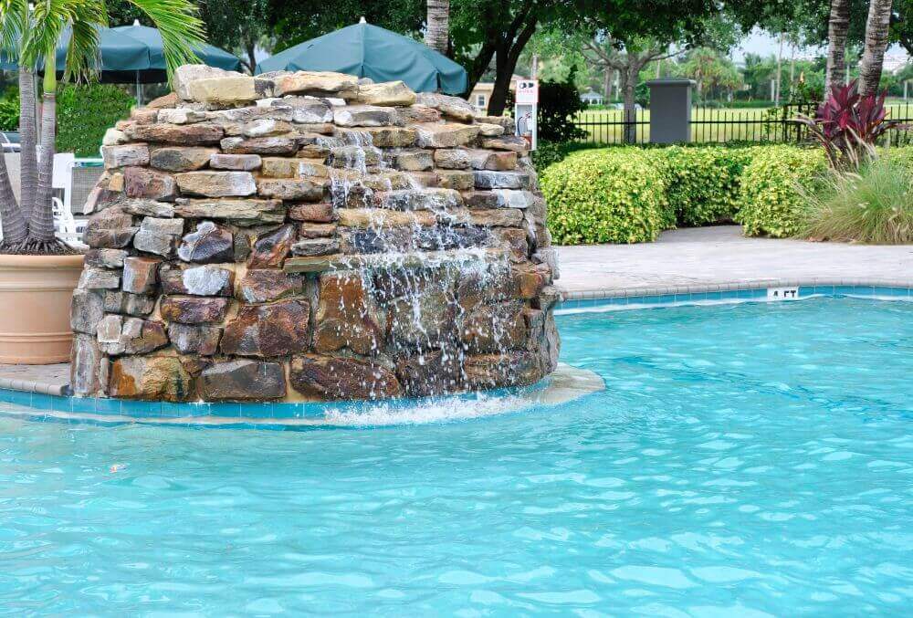 Rock waterfall feature in a inground pool