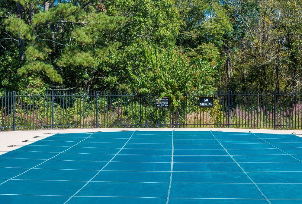 Swimming pool with cover in preparation for winter