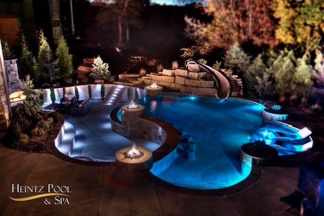 Custom shaped pool with fire pits