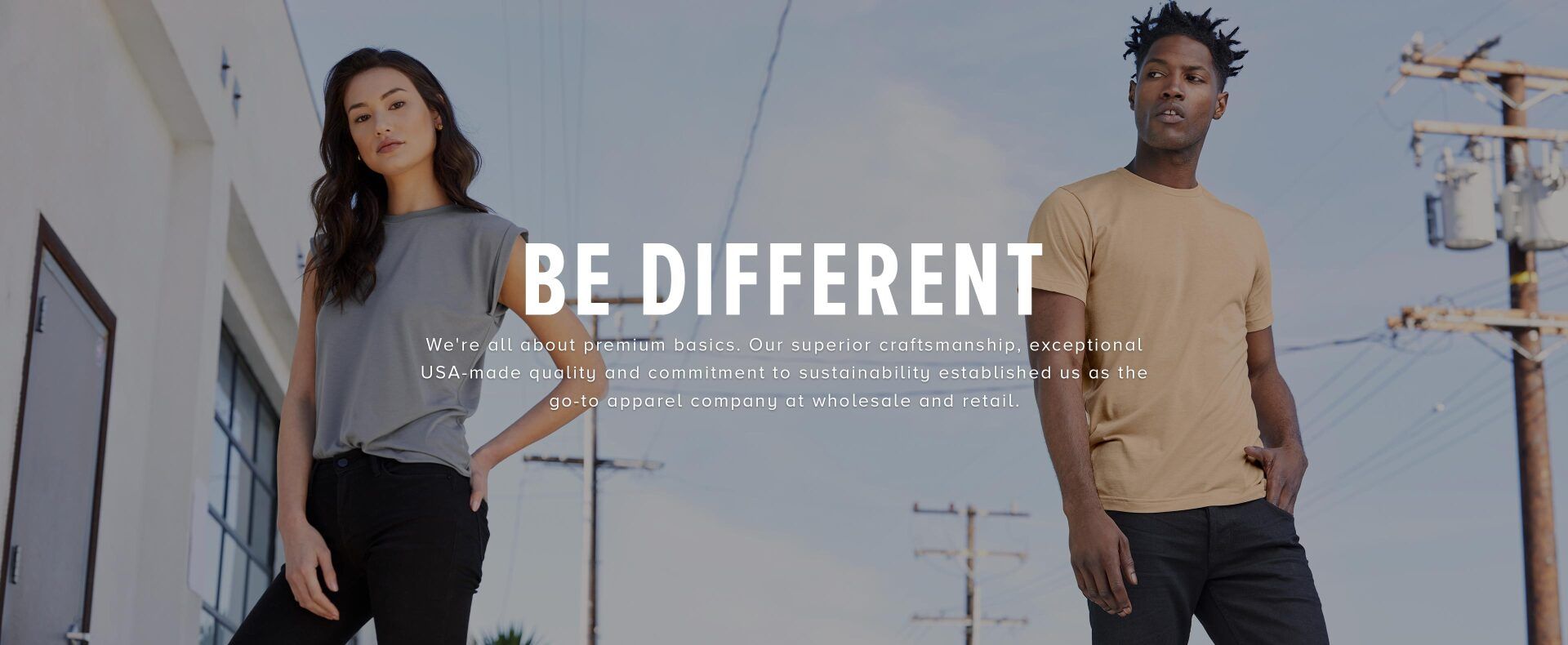 a man and a woman are standing next to each other in front of a building
