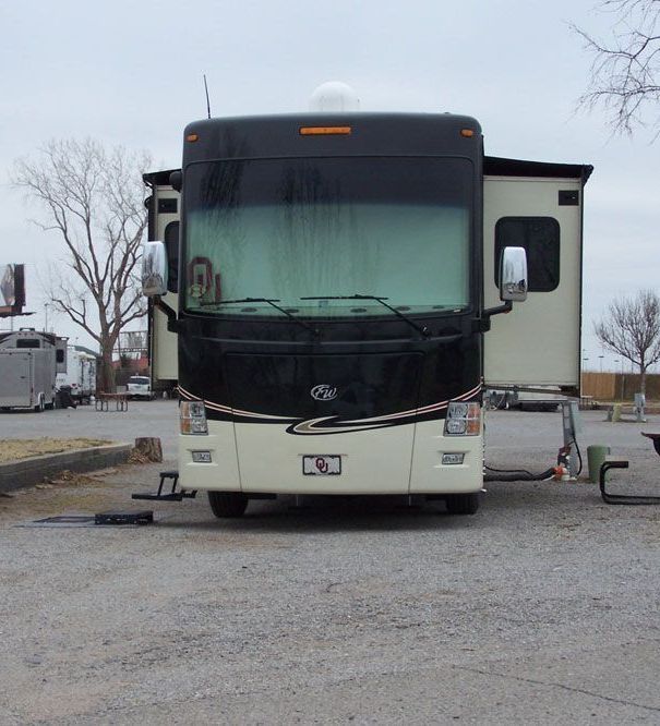 A large rv is parked in a parking lot
