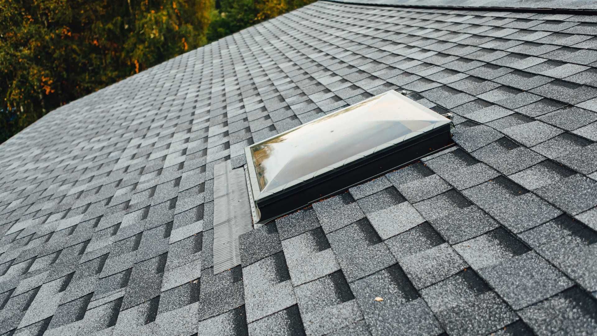 A roof with a skylight on top of it.