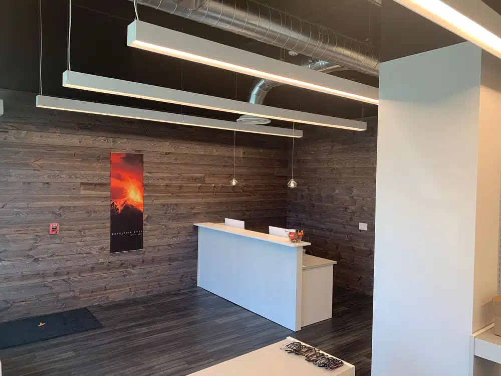 There is a reception desk in the middle of the room.
