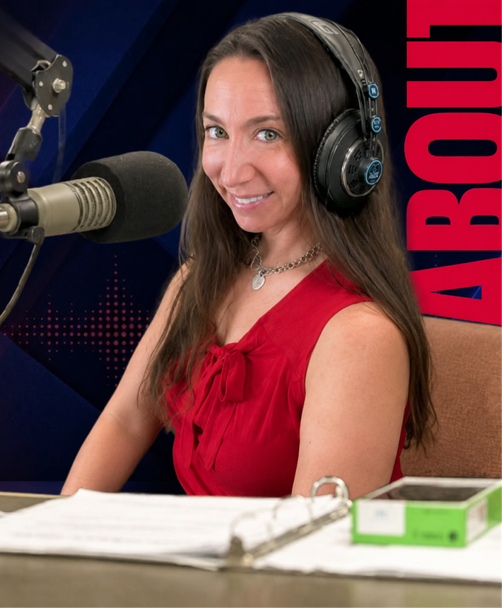 Woman in red top wearing headphones at a radio microphone, smiling in a studio.