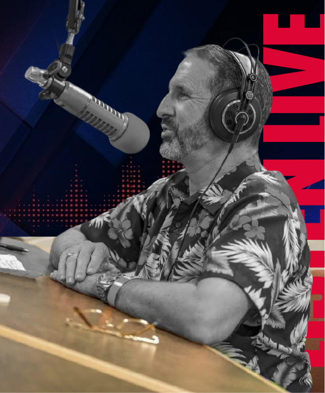 Man speaking into a studio microphone, wearing headphones, seated at a desk with LIVE text in the background