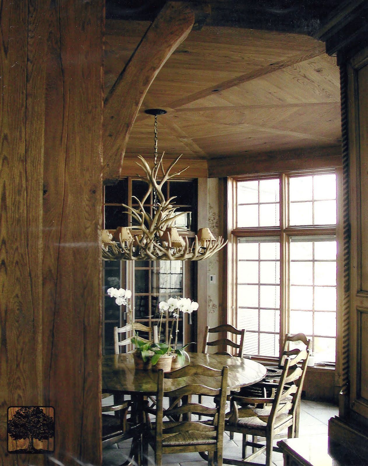 a dining room with a table and chairs and a chandelier