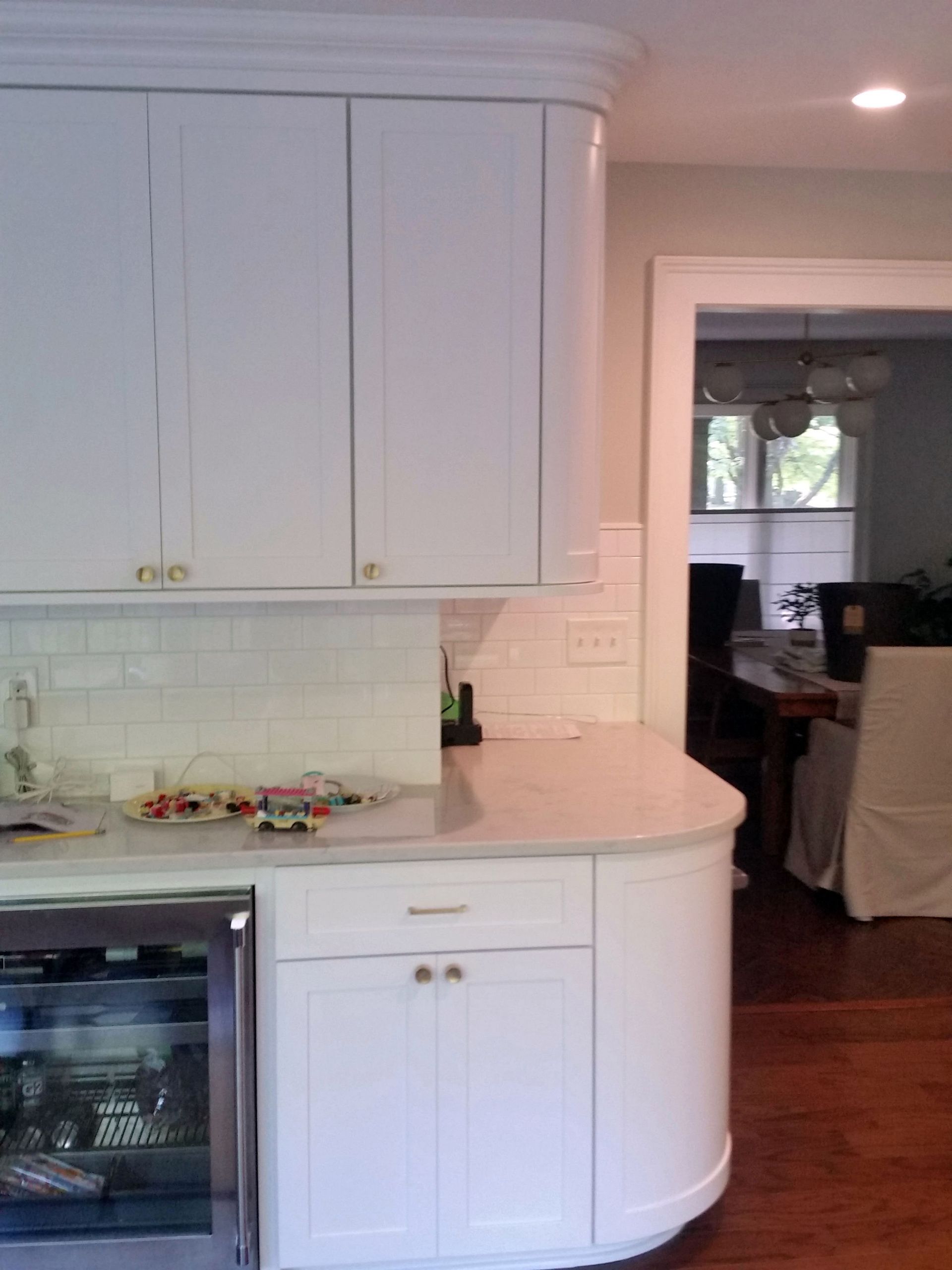 a kitchen with white cabinets and a stainless steel refrigerator Shawnee