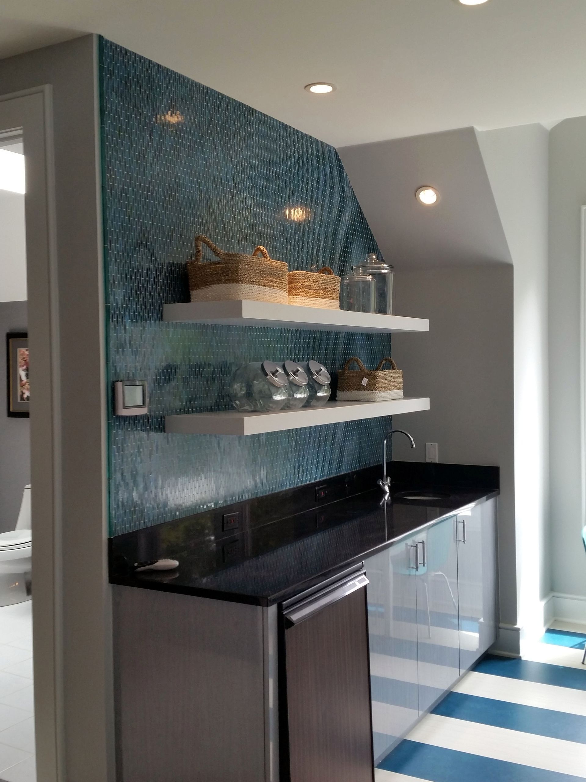 a kitchen with  and a black counter top