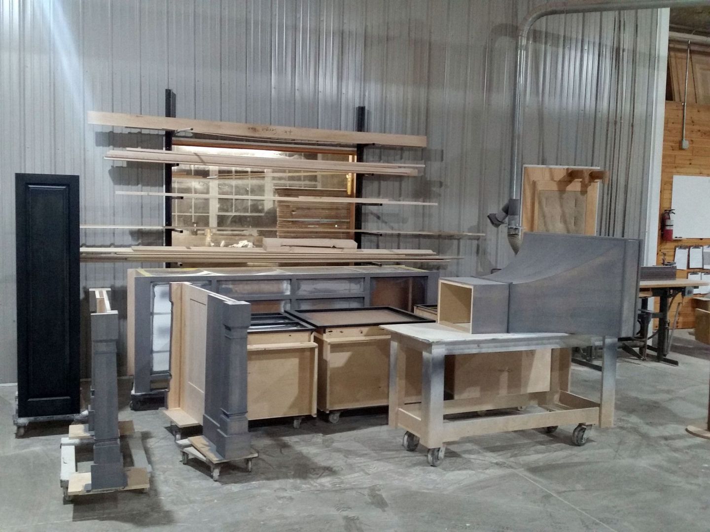 a warehouse filled with wooden cabinets and a table
