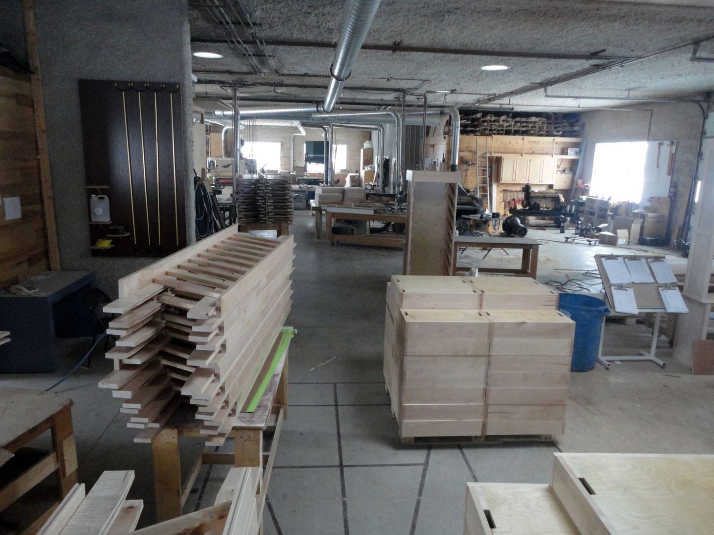 a large room filled with lots of wooden pieces
