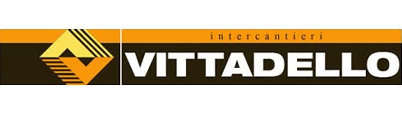 Logo per Vittadello intercantieri, caratterizzato da un disegno a forma di V giallo/arancione e rettangoli grigio scuro e arancioni.