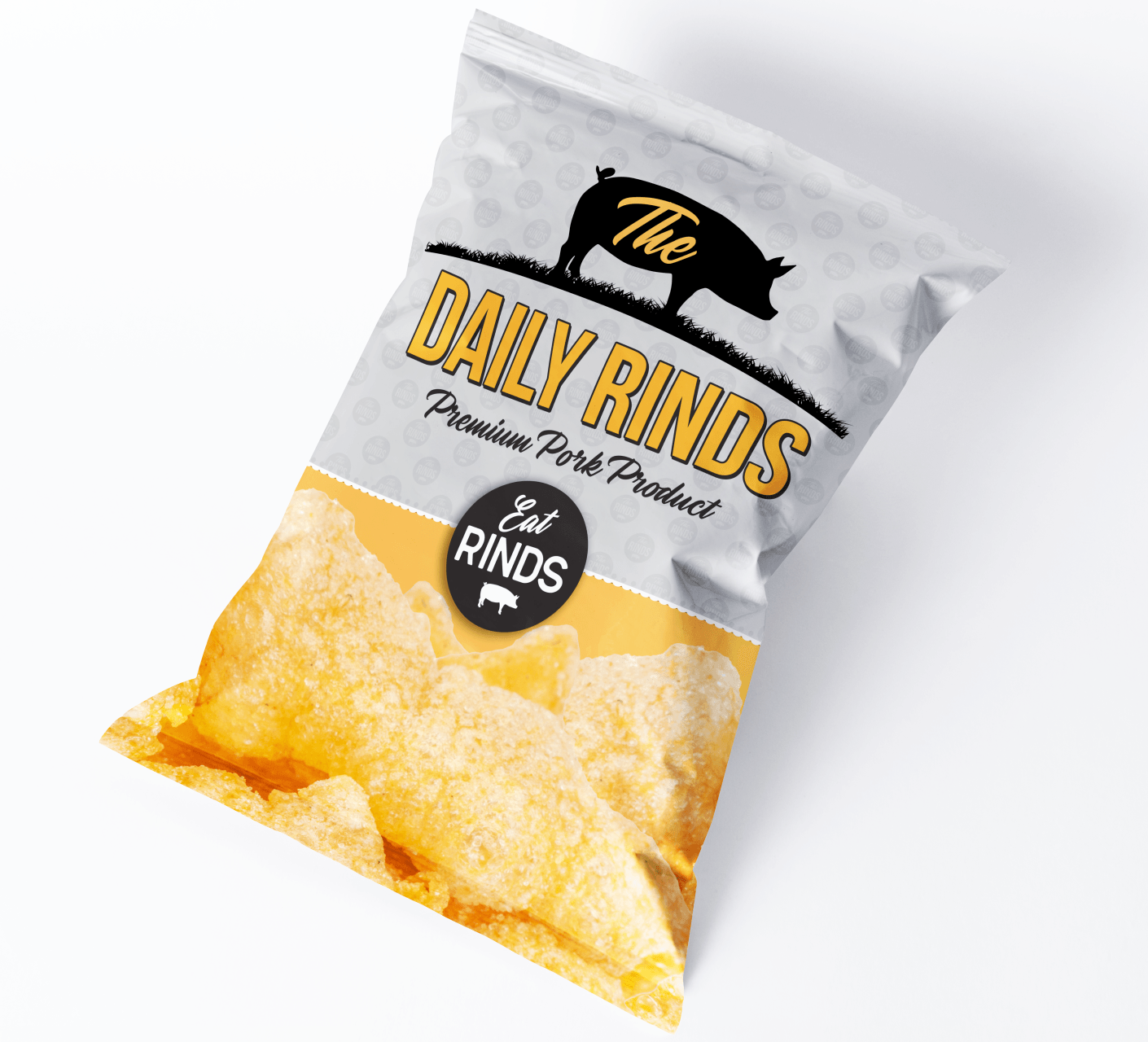 A bag of daily rinds pork rinds is sitting on a table.